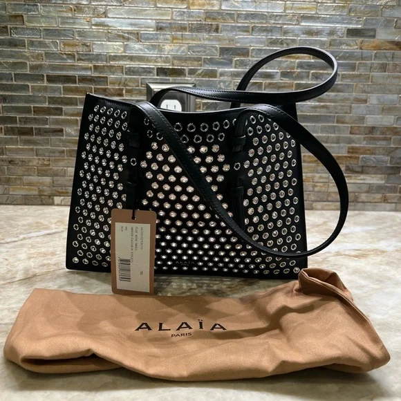 ALAÏA Mina Small perforated leather tote bag - Picture 1 of 14